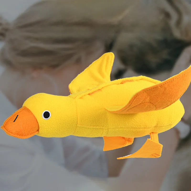 Yellow plush duck dog toy with treat holes and sound module for training and chewing