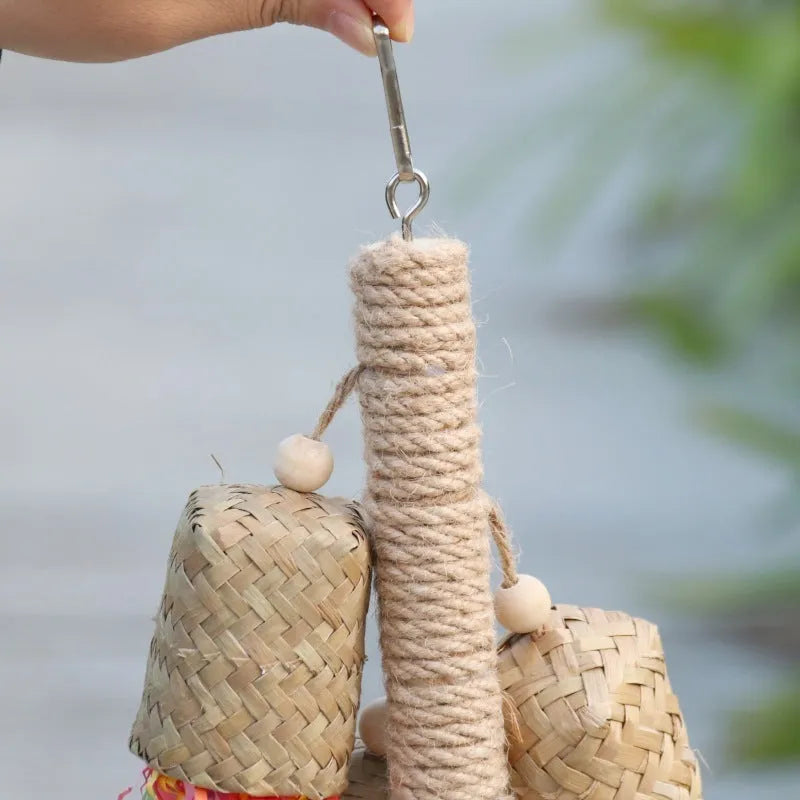 Colourful shredded paper parrot toy made of wood and sisal rope, measuring 35cm long.