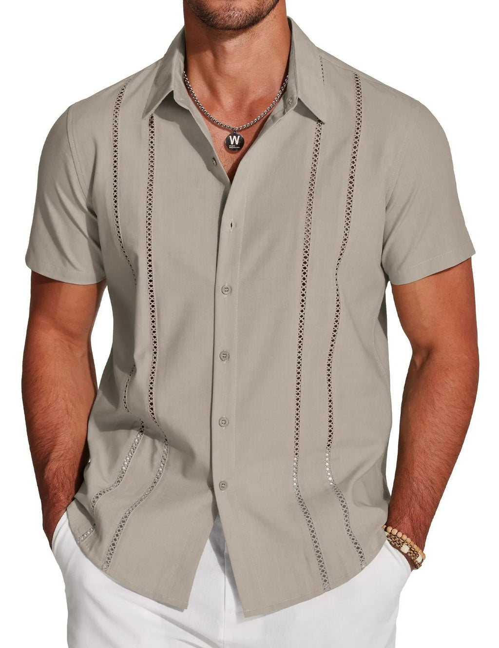 Man wearing a slim fit, short sleeve Hawaiian shirt with a colourful digital print pattern.