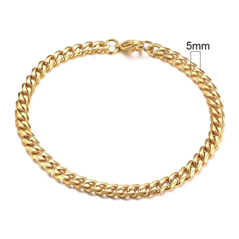 Six-sided geometric link metal bracelet in gold colour on a wrist.