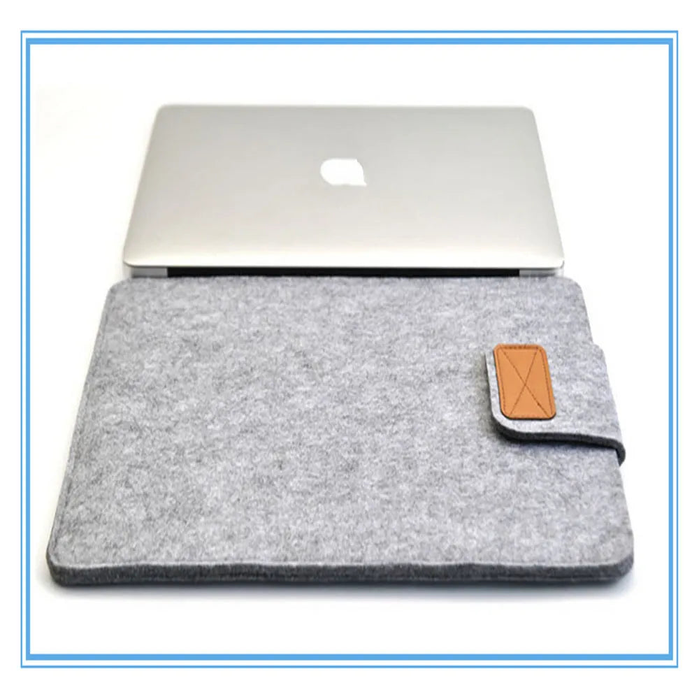 Frosted woven laptop bag with plush felt interior shown open to reveal corner protectors and organised storage