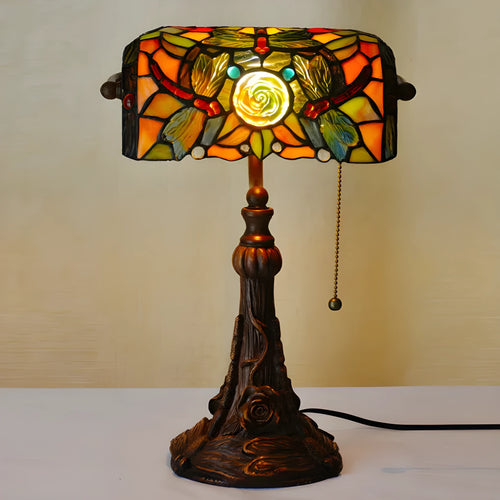 10-inch Tiffany desk lamp with coloured stained glass shade and resin base on a table.