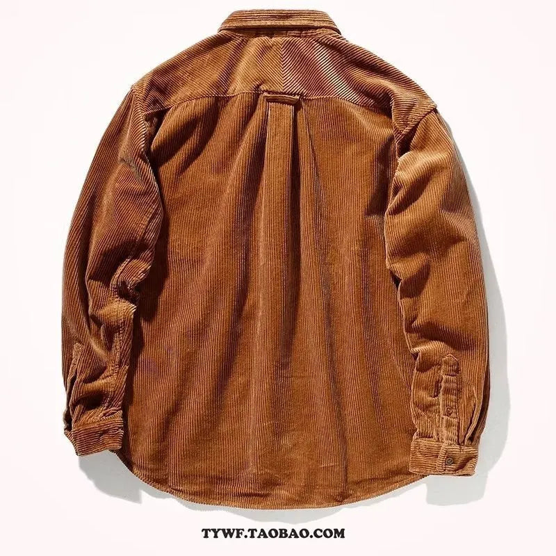A man wearing a caramel coloured corduroy long sleeve cardigan shirt with a loose fit and button front.