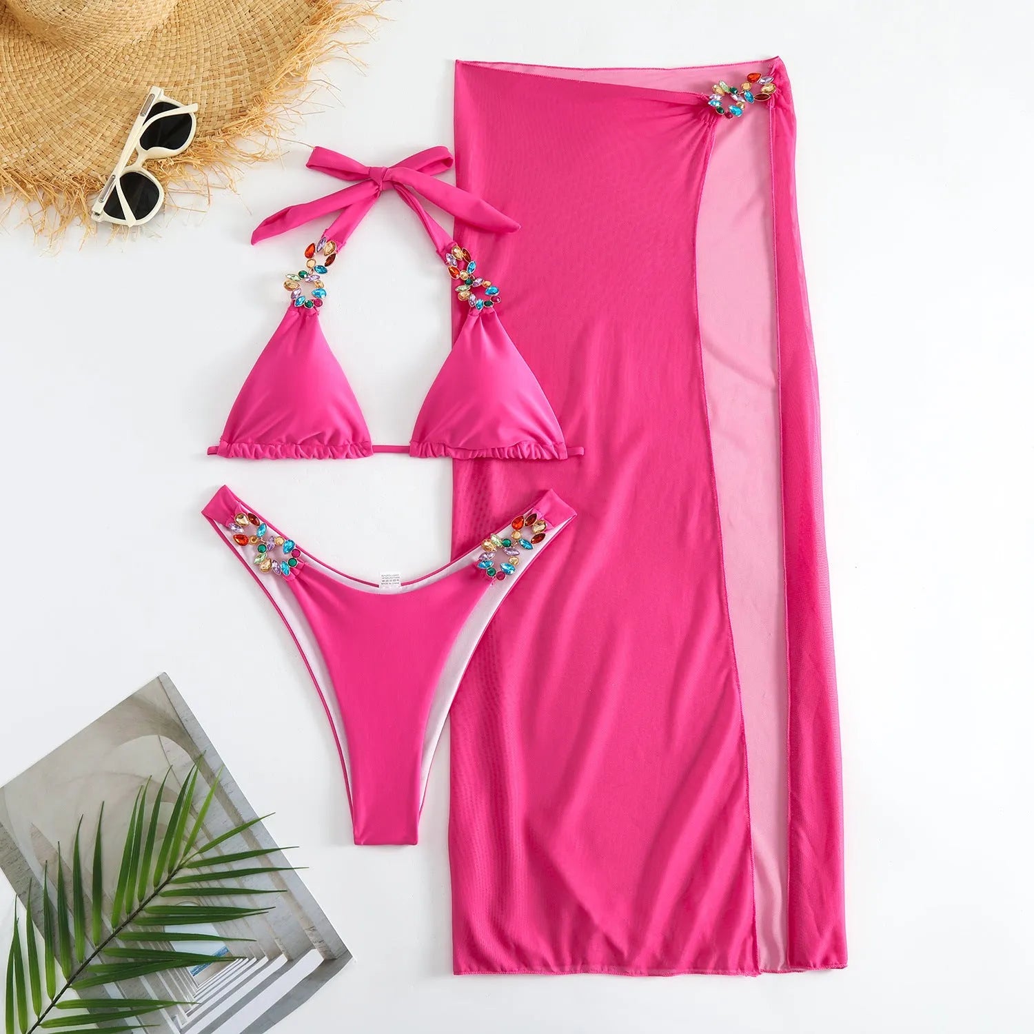 Rose Red three-piece women's swimsuit set with bikini top, briefs, and long mesh skirt laid flat.
