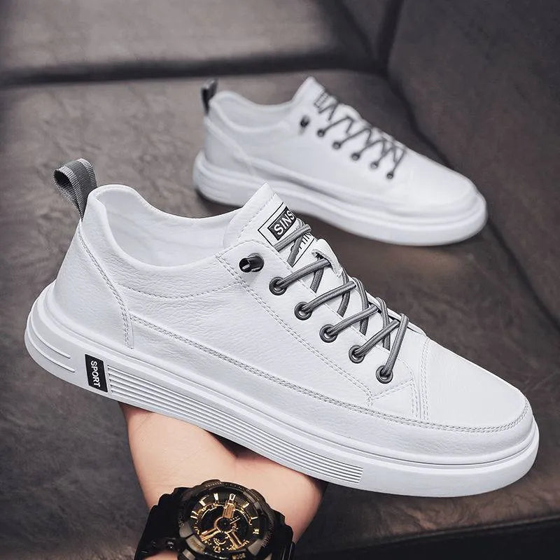 Men's white casual shoes with round toe, flat bottom, and shallow opening design