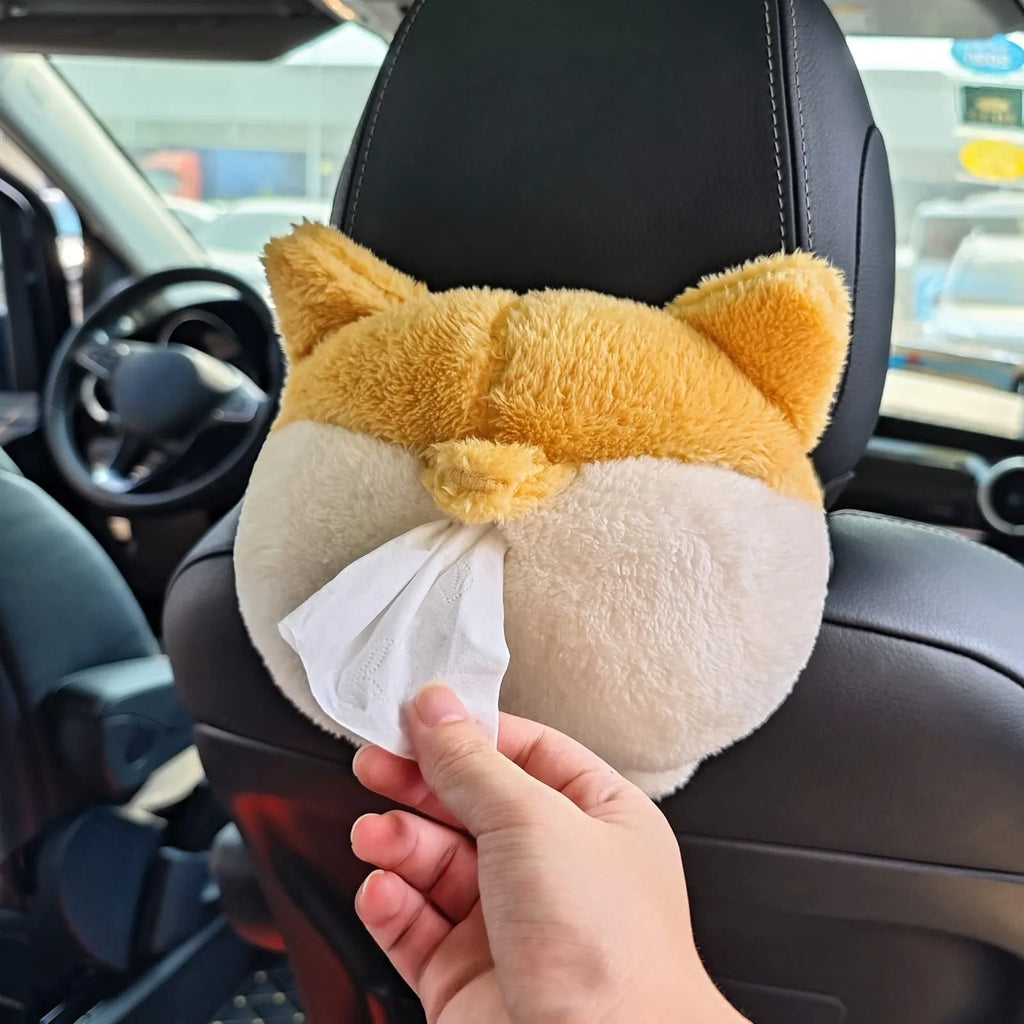 Yellow corgi butt-shaped polyester tissue box cover hanging on a car sun visor.