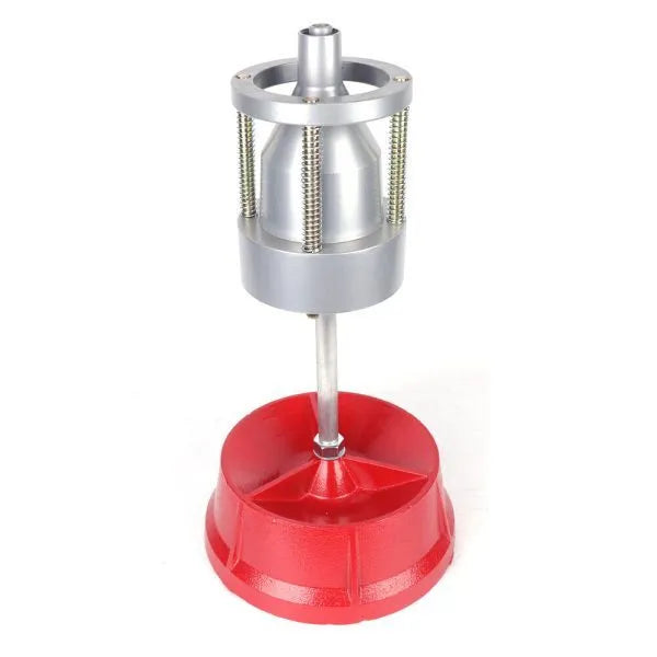 Portable aluminium hub tyre balancer with bull's eye level on enamel base.