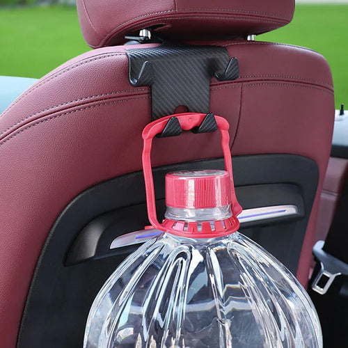 Black ABS plastic car hook and phone holder bracket mounted behind a car seat headrest.