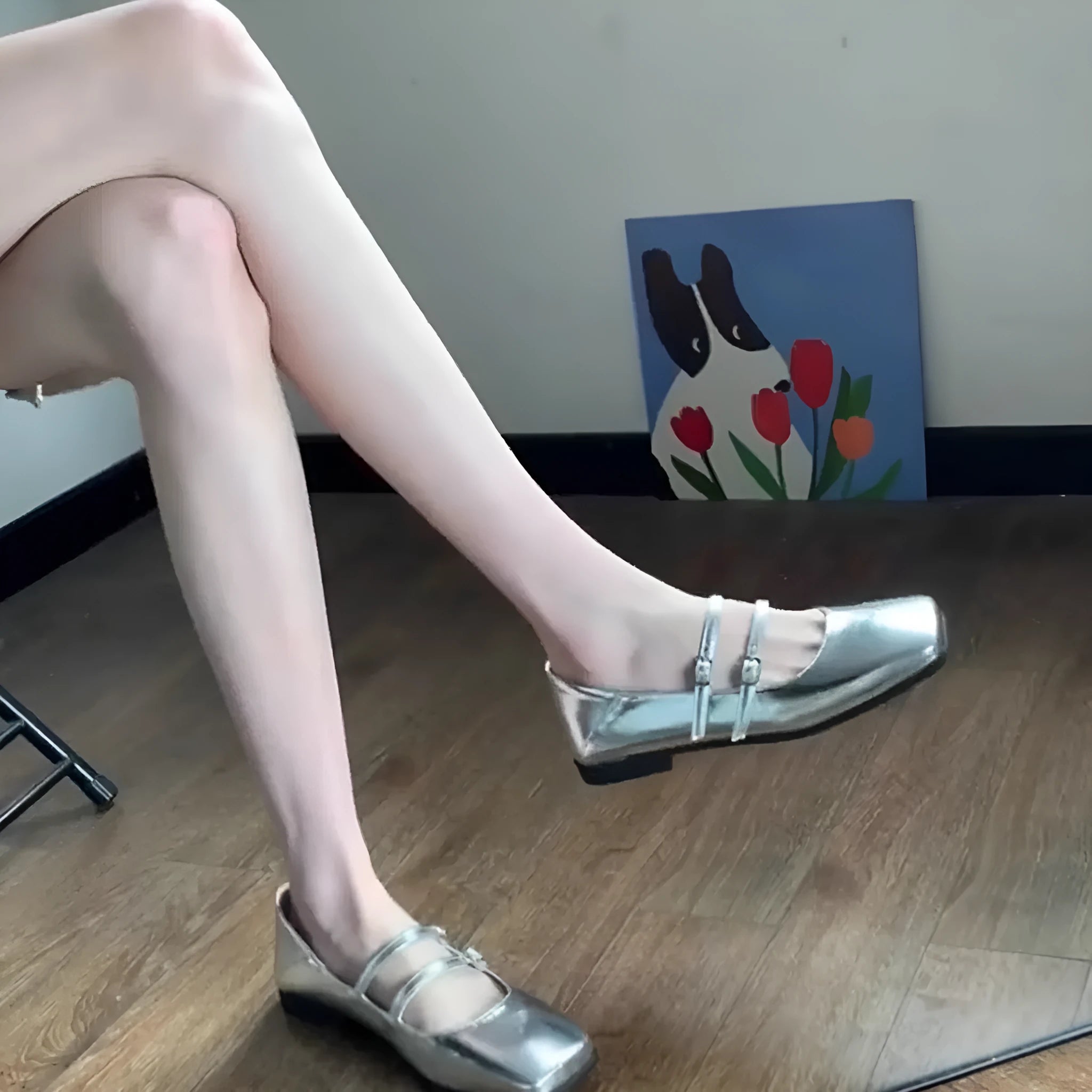 Women's silver ballet slipper pumps with a cross buckle strap, made from sheepskin leather with a flat heel.