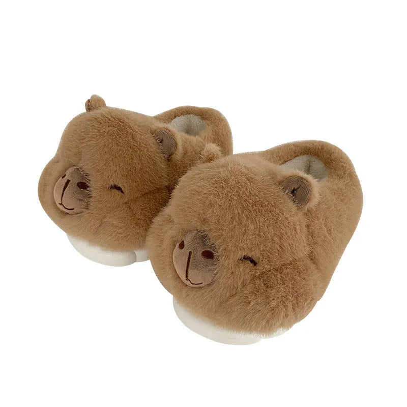 Light brown women's plush winter slippers with cartoon pattern and artificial wool lining.
