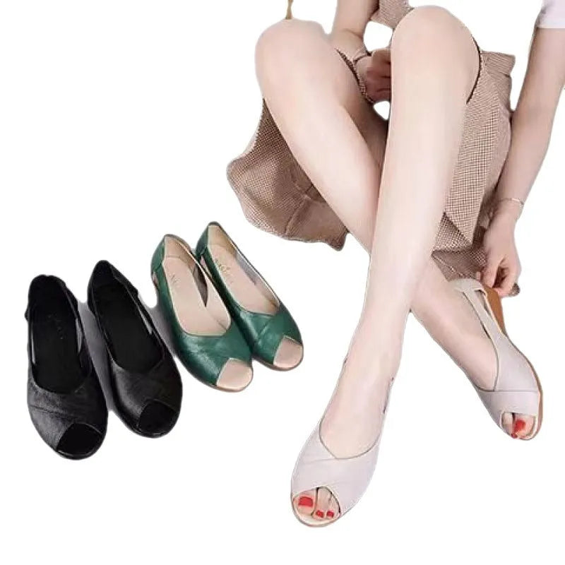 Women's black peep toe sandals with an ankle buckle and a rubber mid heel on a white background.