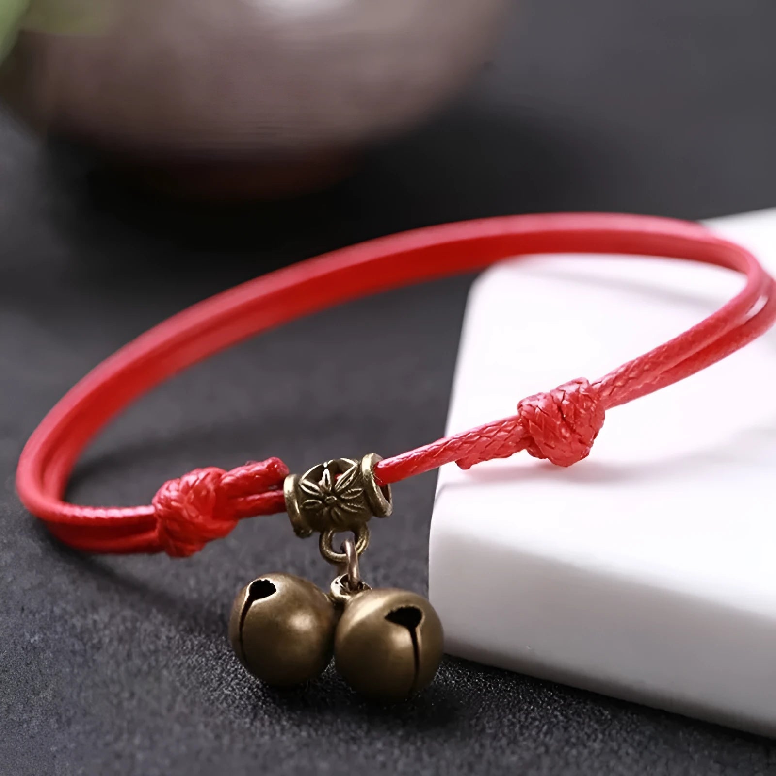 A nylon rope dog collar with brass fittings, shown in black, red, and coffee colours.