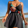 Black women's high-waist bikini briefs with a printed split design on a mannequin.