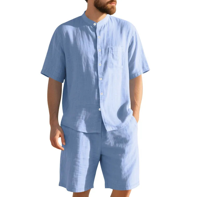 Man wearing a light blue linen blend short sleeve shirt and matching shorts, a casual summer two-piece suit.