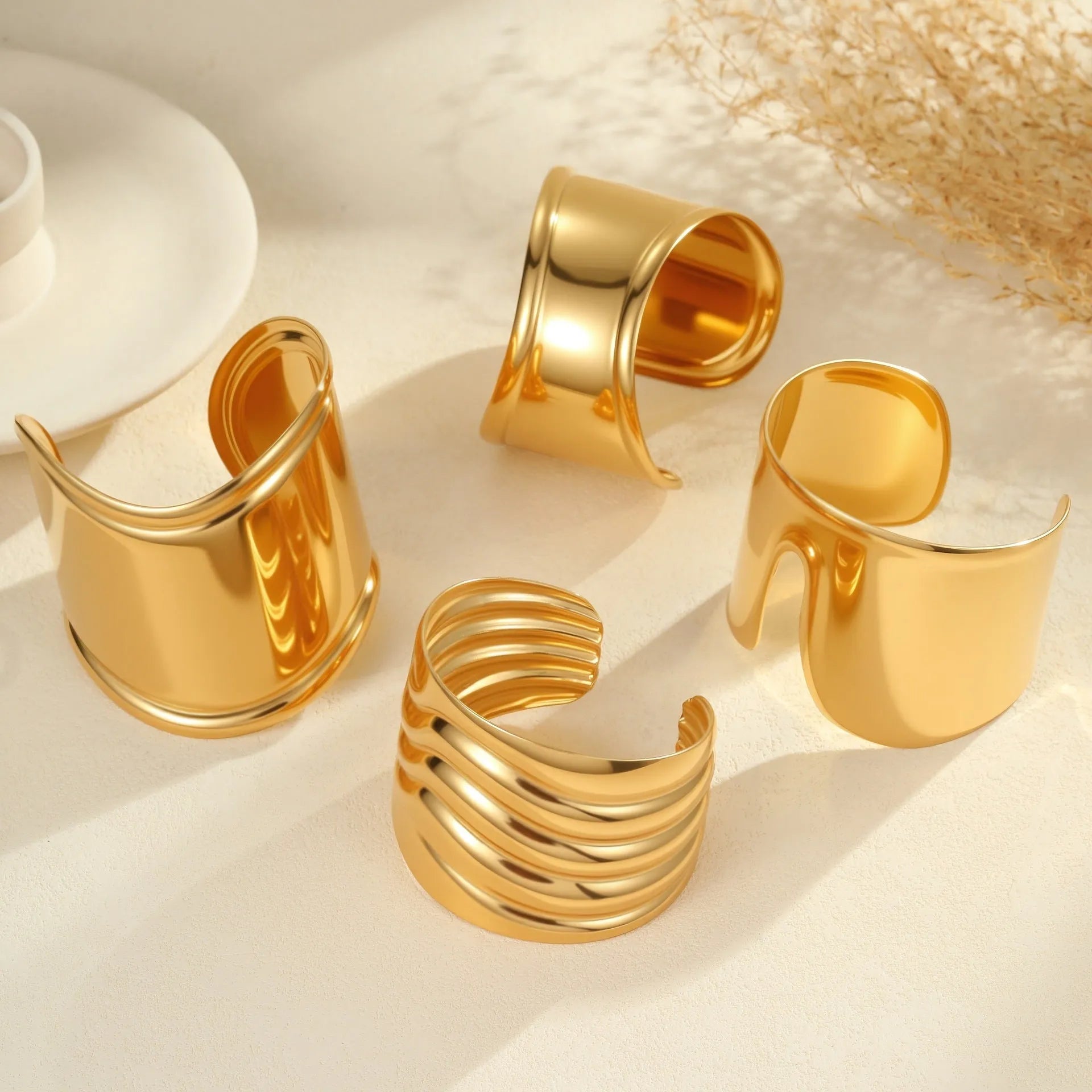 Women's 18K gold plated stainless steel bracelet with exaggerated wide wave geometric design