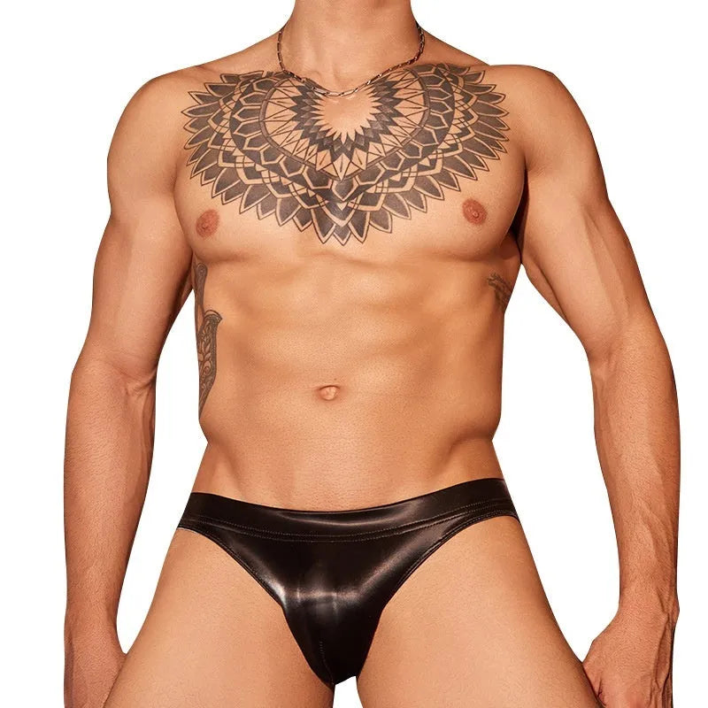 Men's black shark skin lace hip brief underwear laid flat, showing free size label.