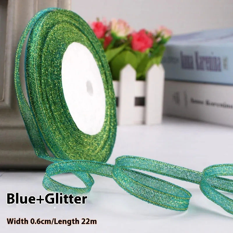 Roll of polyester gift ribbon showing 0.6cm width and multiple colour options including metallic finishes