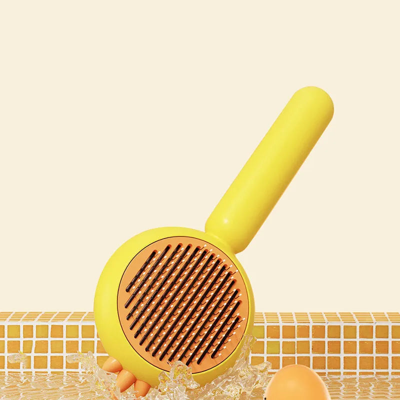Self-cleaning pet grooming brush in purple, with stainless steel bristles and a one-button release.