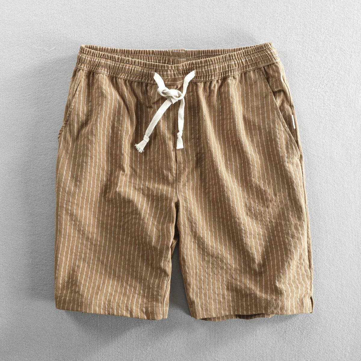 Men's striped casual shorts in cotton with elastic waistband shown in multiple colour options