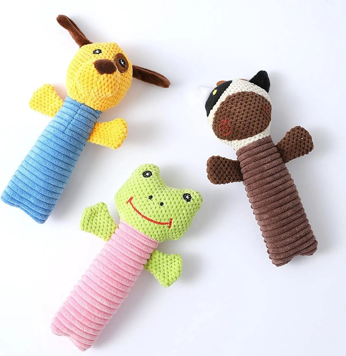 Soft plush dog chew toy in animal shape with squeaker, shown with size scale.