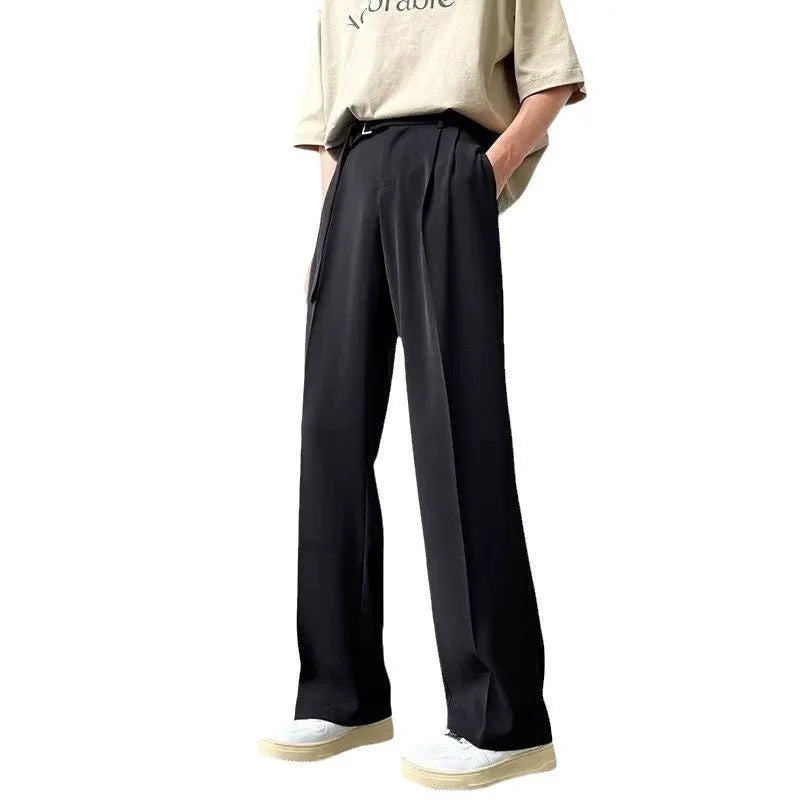 Thin straight black wide leg loose trousers laid flat, showing non-ironing casual style.