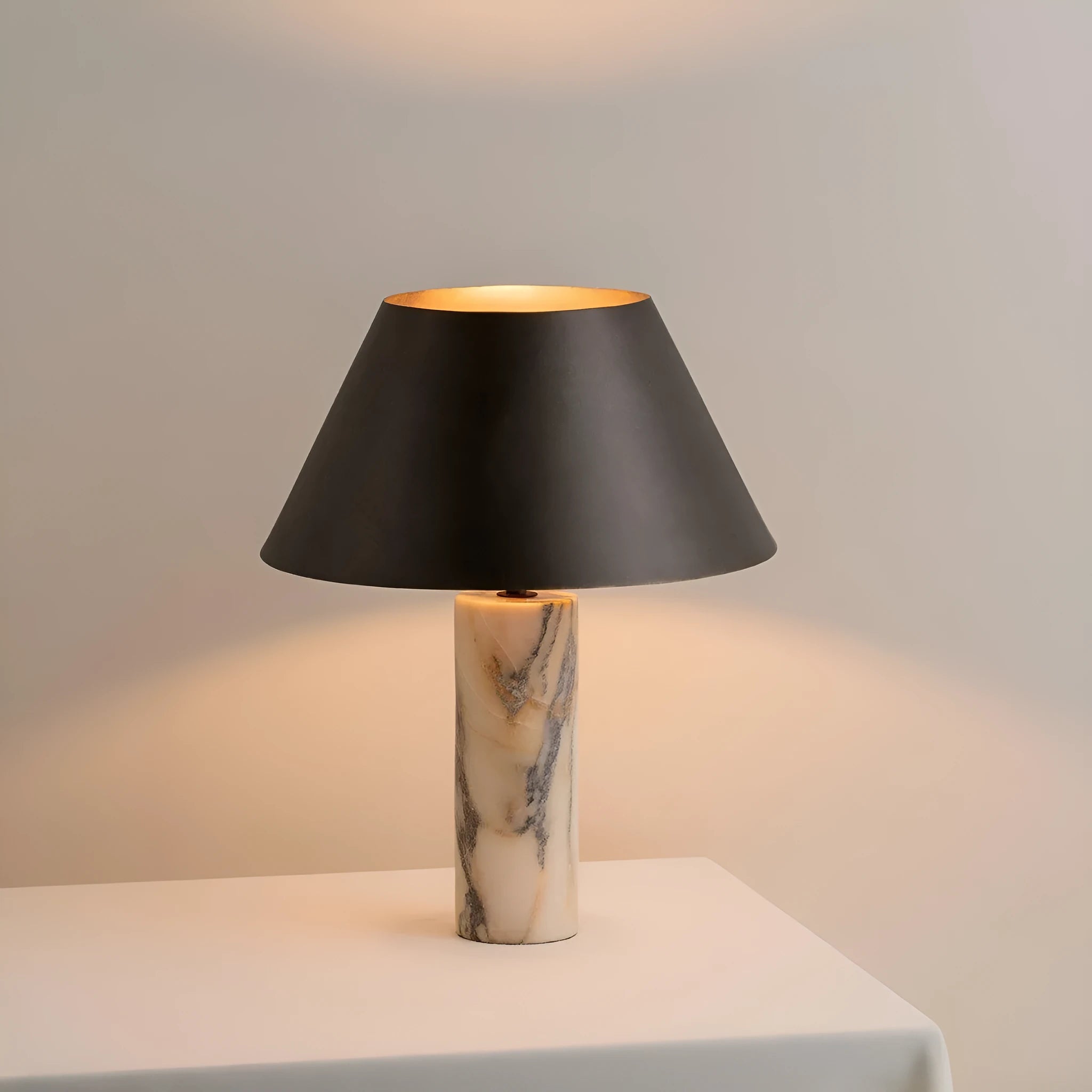 Modern black marble table lamp with minimalist design on wooden surface