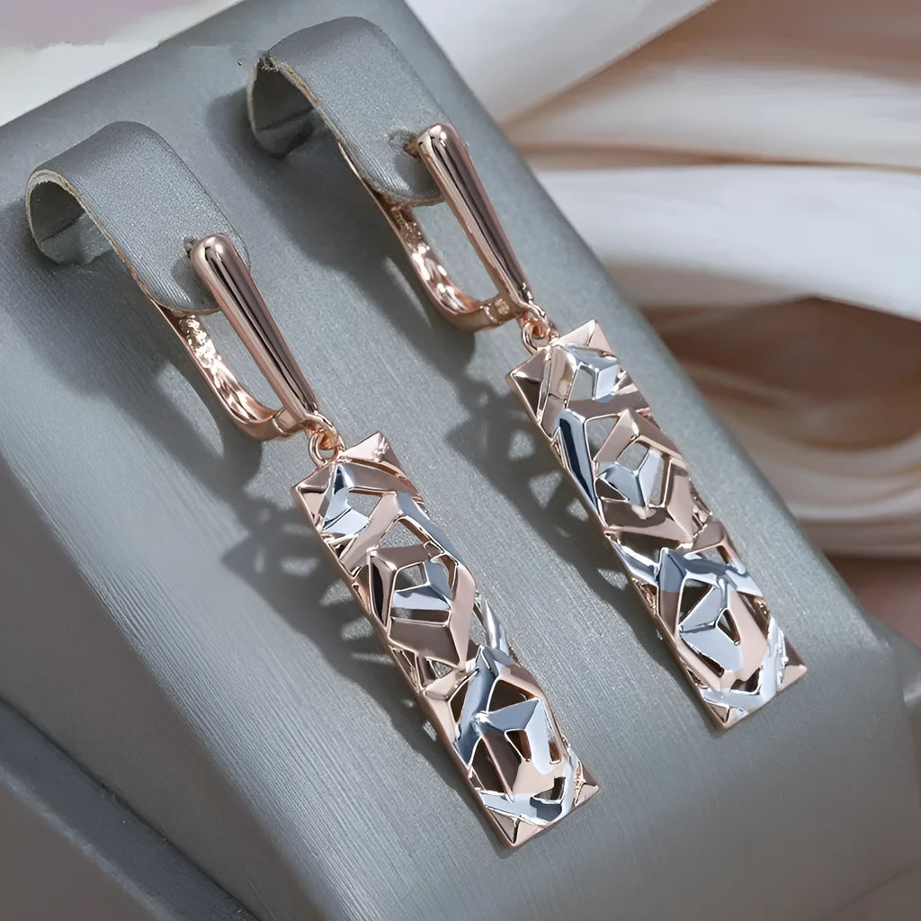 Rectangular two-tone hollow stud earrings with geometric openwork centre and electroplated finish