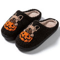 Halloween pumpkin slippers in black or white with plush material and rubber soles