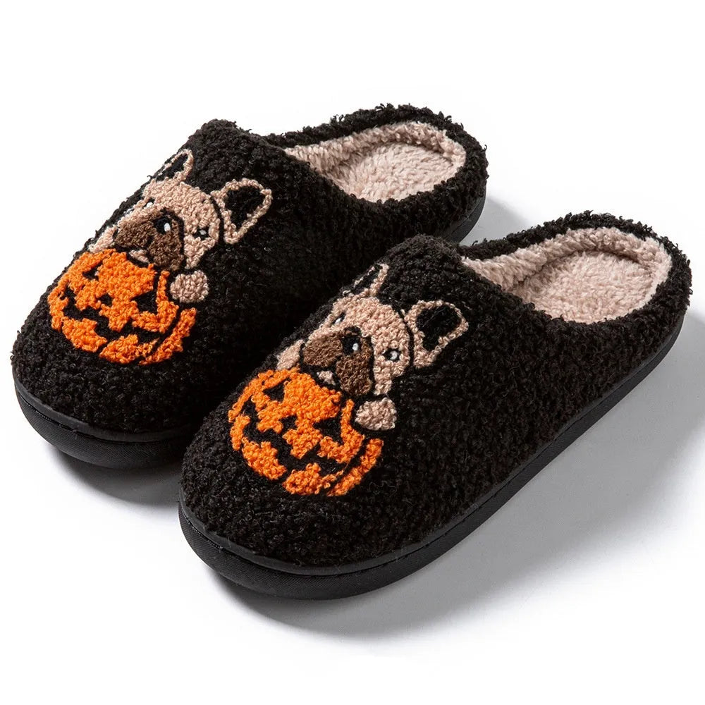 Halloween pumpkin slippers in black or white with plush material and rubber soles
