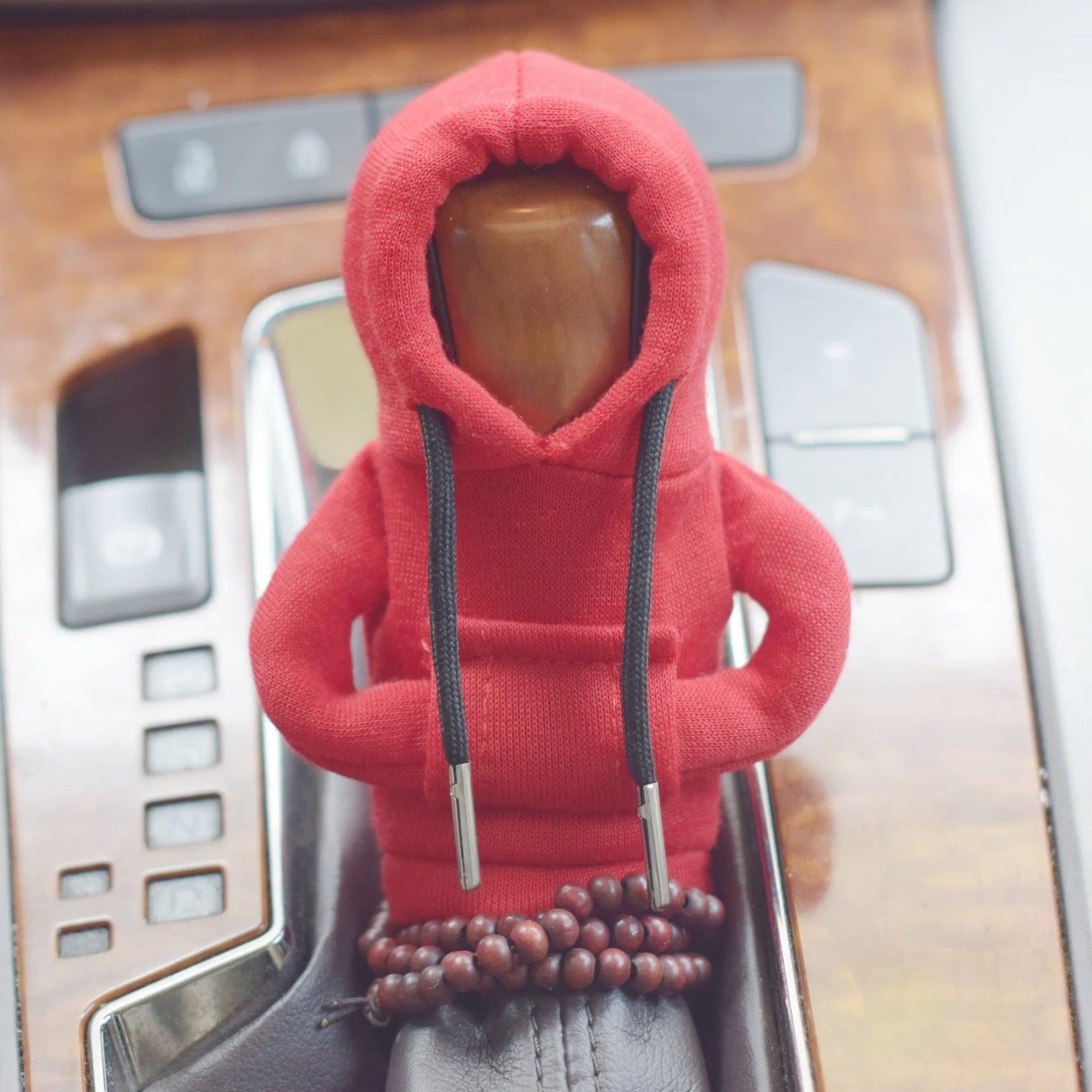 Soft Dutch velvet car gear handle cover in multiple colours on a gear stick.