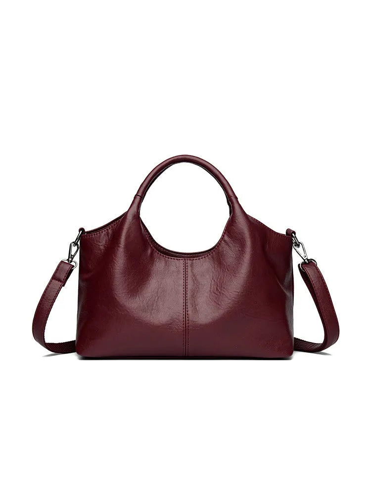 Genuine leather women's cross-body bag in a choice of seven colours including black, brown, and wine red