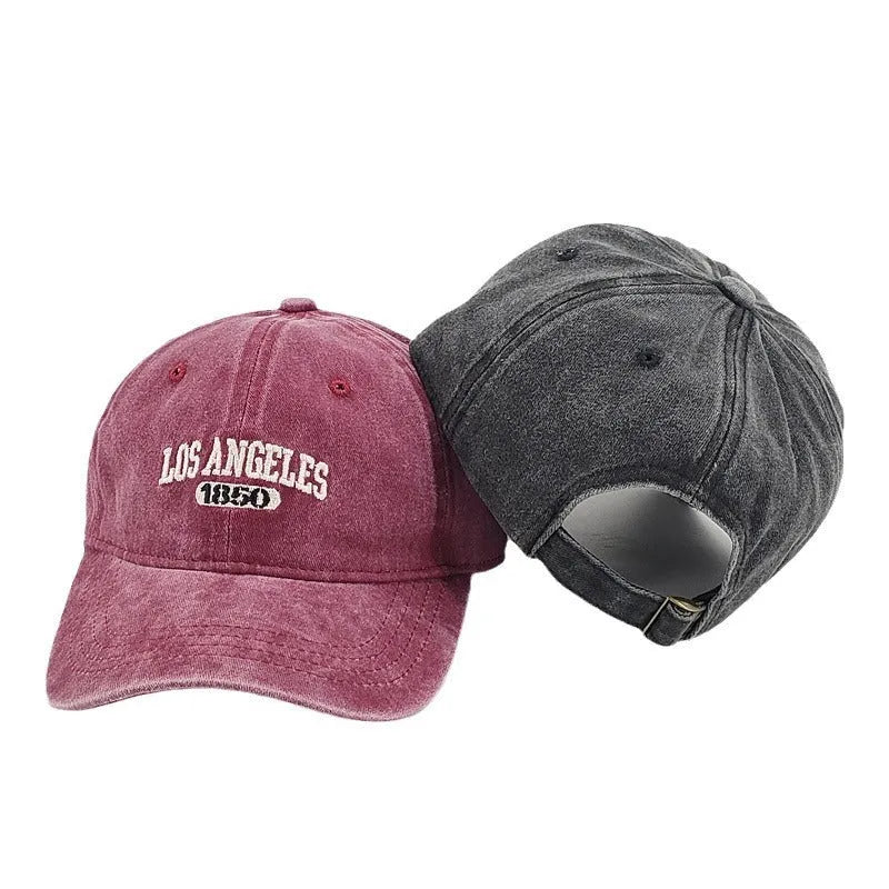 Retro adjustable peaked cap with distressed embroidery in conical crown design