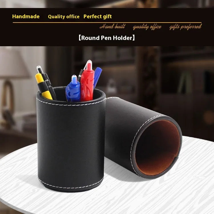 Round black leather pen container measuring 8.0cm diameter and 10.8cm height