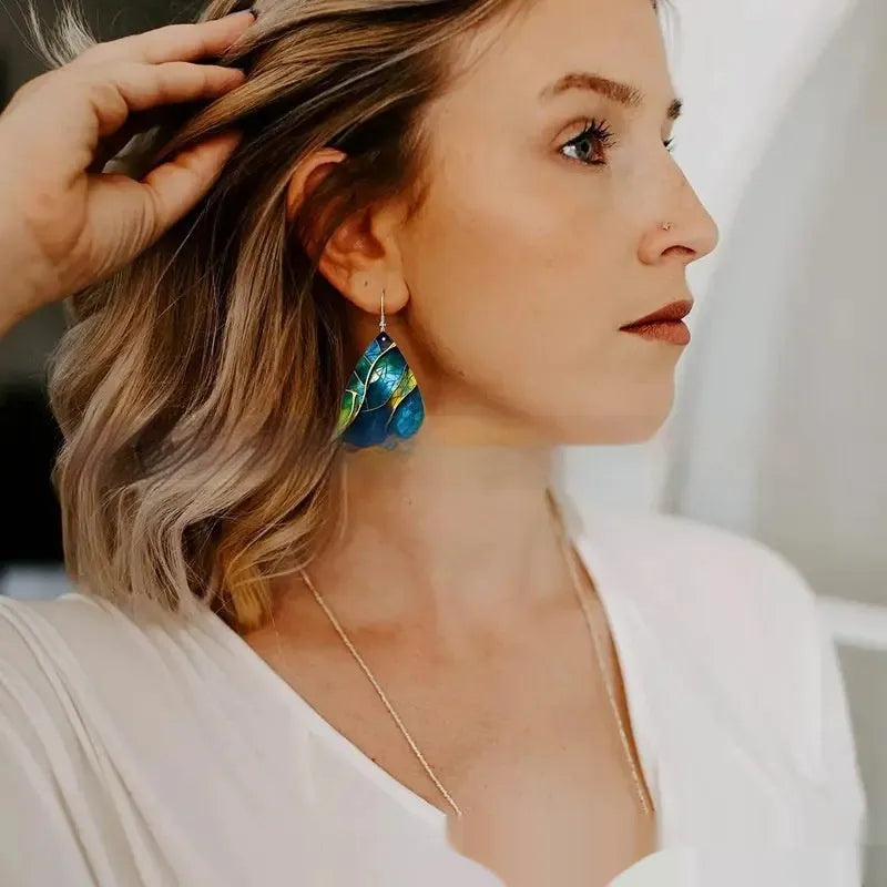 Pair of flat acrylic drop earrings with printed branch knot design in unisex style
