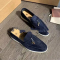Gommino style high-top slip-on loafers in black with rubber sole and round steel toe.