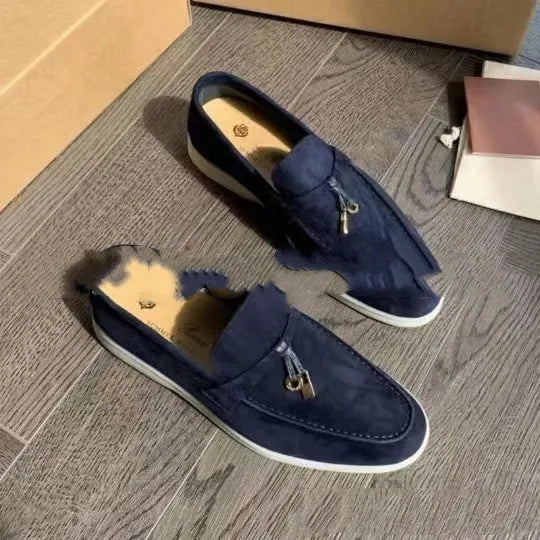 Gommino style high-top slip-on loafers in black with rubber sole and round steel toe.