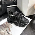 Women's creamy white platform sneakers with wedge heel, cross-strap detail, and lace-up front.