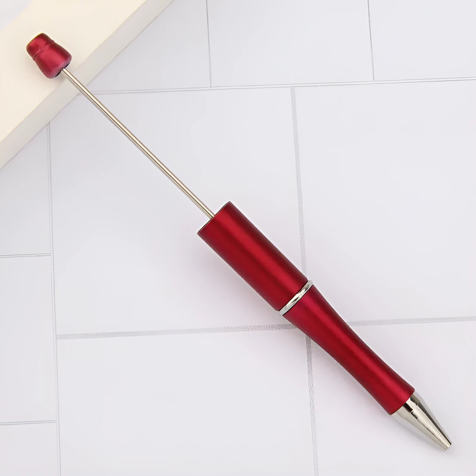 Creative ballpoint pen with multicoloured spinning plastic beads on a steel wire frame.