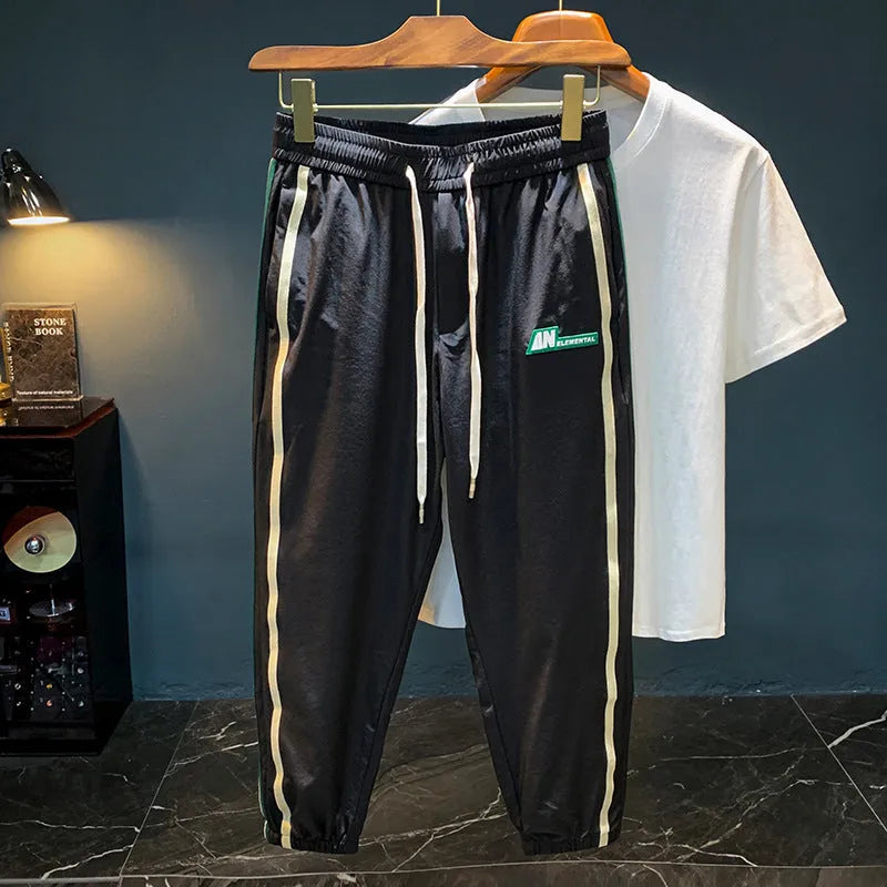 Men's solid colour cotton harem pants with elastic waistband in black or grey