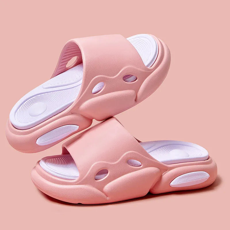 Women's and men's two-colour thick-soled EVA slippers with leather lining on a beach