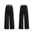 Straight-leg trousers with button-open line design in black or grey colours, high waist construction