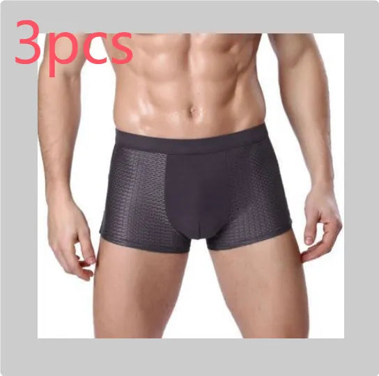 Men's solid colour ice silk modal boxer briefs with a U convex design on a mid waist.