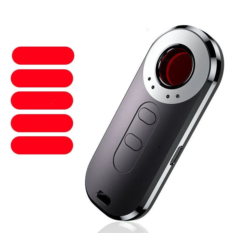 AK400 portable infrared anti-monitoring detector with USB cable on a table.