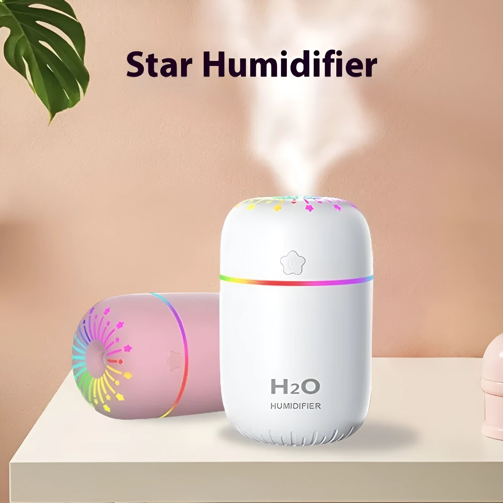 Small white Fireworks USB desktop humidifier with water tank on a wooden desk.