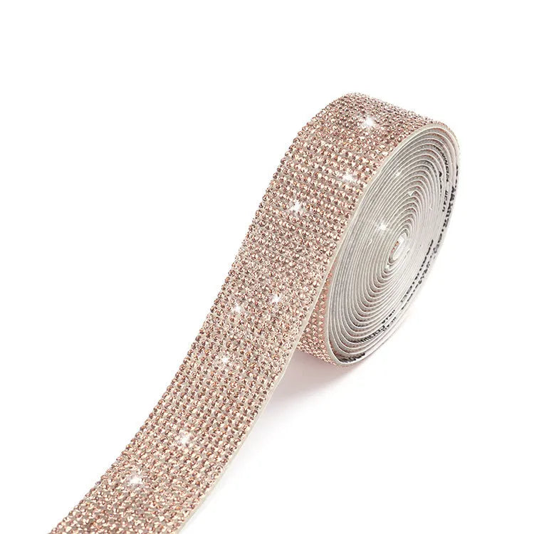 Self-adhesive glass rhinestone strip on a roll showing white and AB colour options.