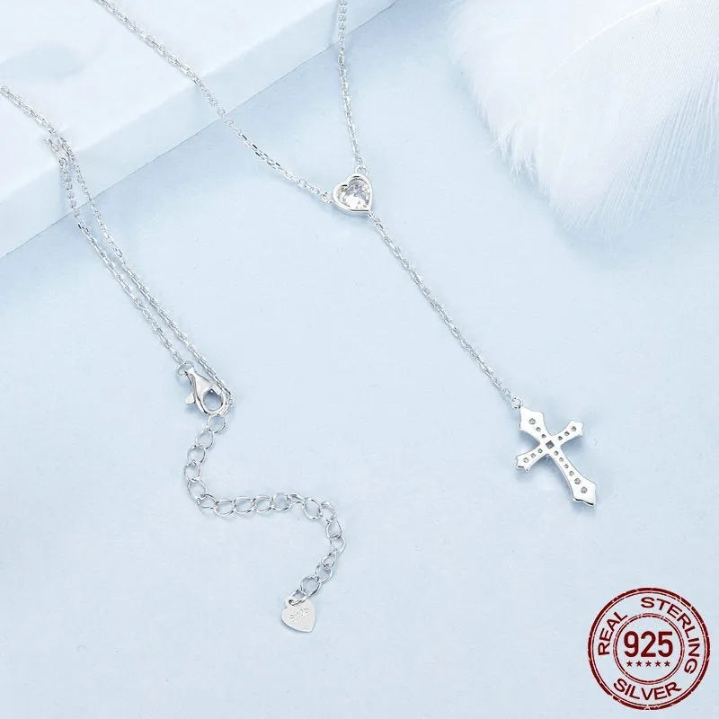 Women's silver love cross necklace on a V-neck O-ring chain, BSN384 colour.
