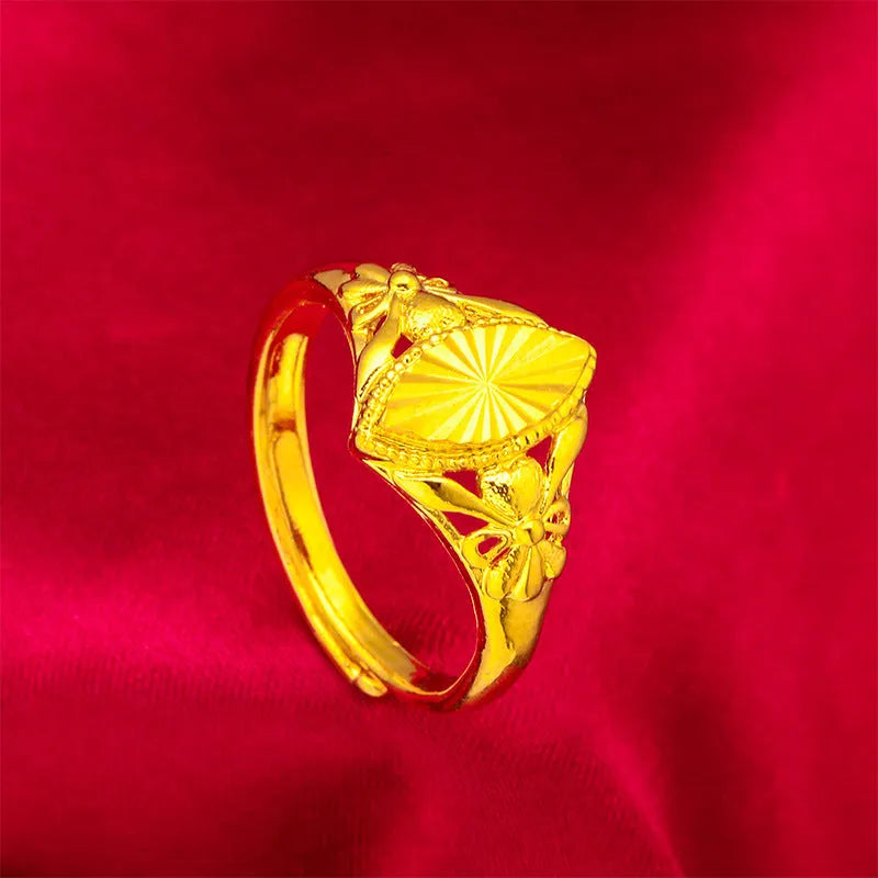 Gold geometric flower ring with textured brass construction and open diamond design