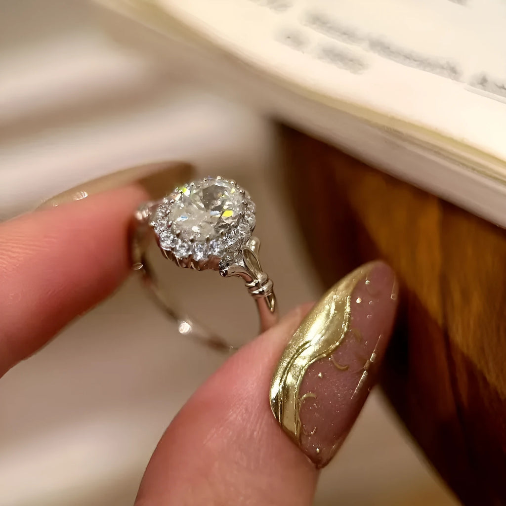 Silver geometric bridal bouquet ring with adjustable opening and diamond-treated elliptical element