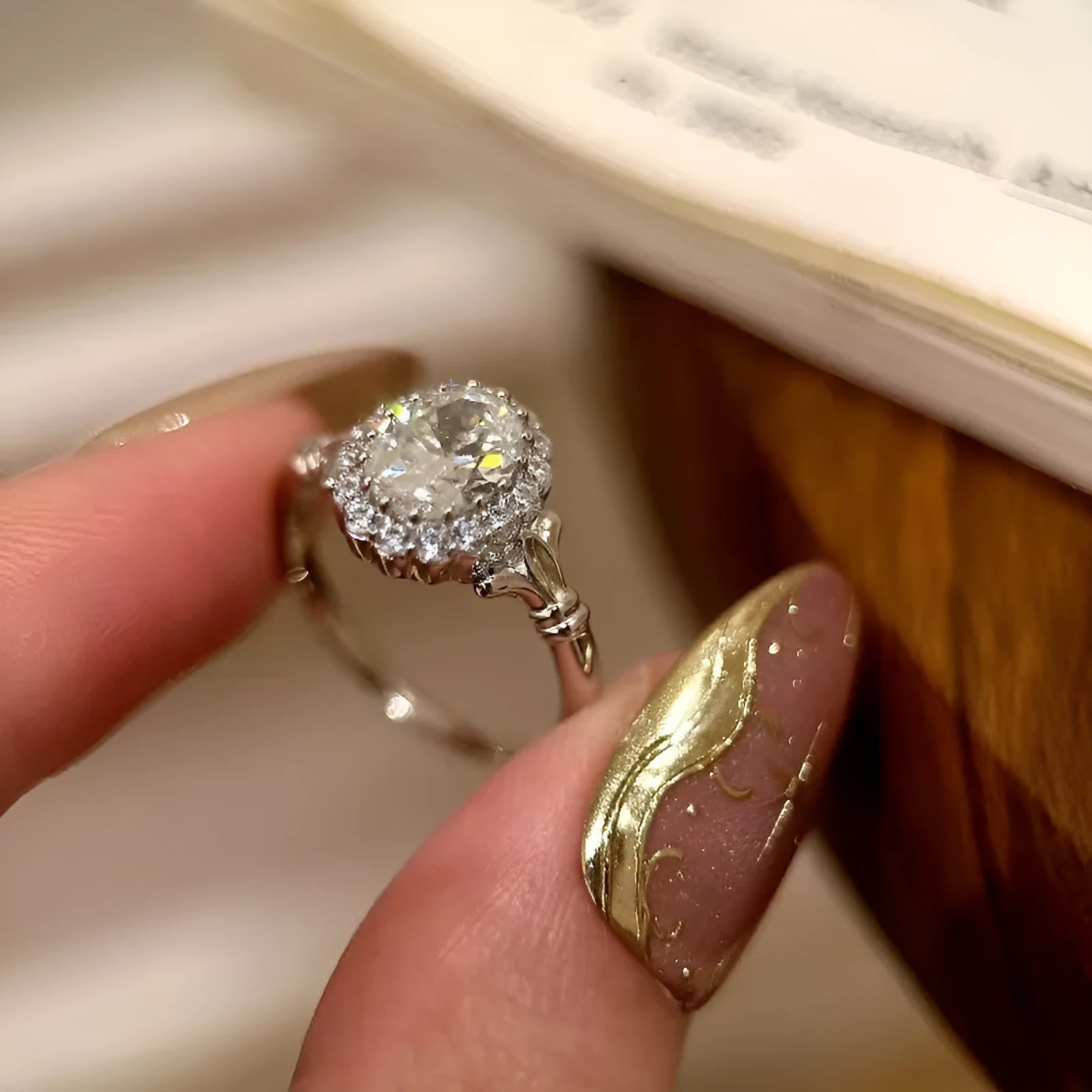 Silver geometric bridal bouquet ring with adjustable opening and diamond-treated elliptical element