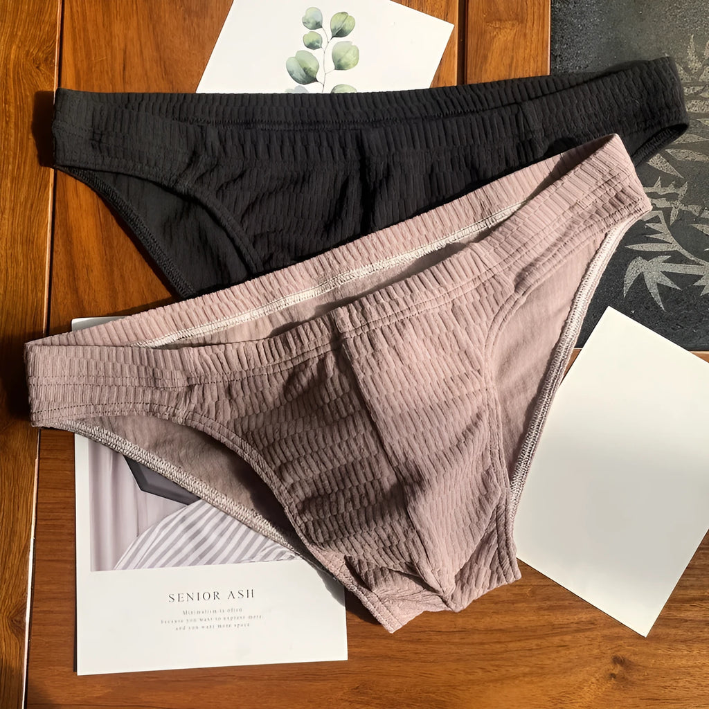 Men's solid colour cotton triangle underwear briefs with mid waistband, shown in apricot black colour.